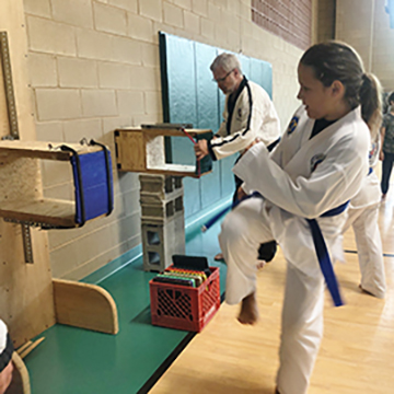 aleksandra preparing to break board