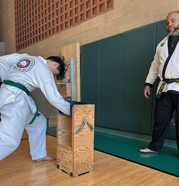 student breaking board