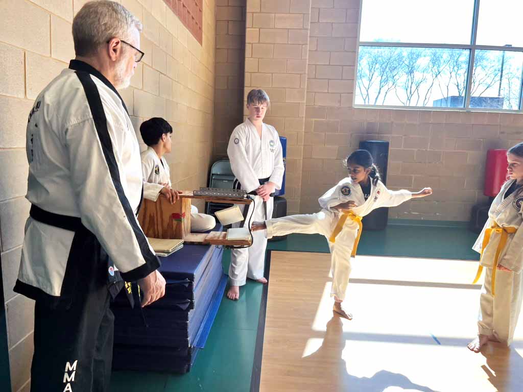 Yellow belt girl board break